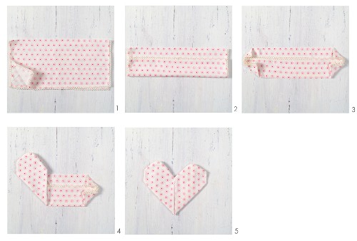 Instruction for folding napkins into love-hearts