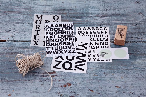 Letter stickers and a wooden stamp for decorating and labelling gifts
