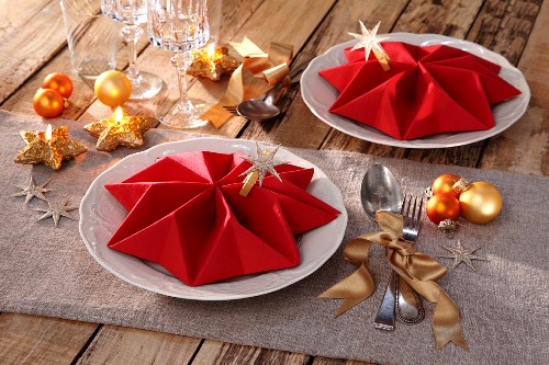 Folded napkins as festive table decorations