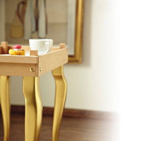DIY tray table with golden legs made from wooden laths