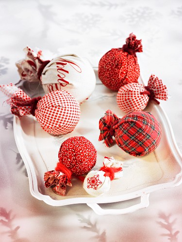 Christmas tree baubles wrapped in patterned cloths