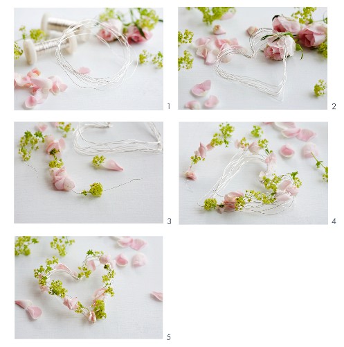 A romantic heart-shaped floral wreath being made