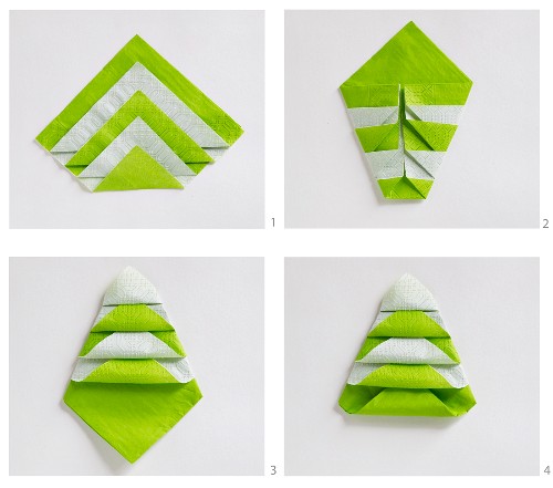 Instructions for folding white and green paper serviettes into Christmas trees