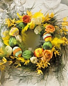 Easter wreath with grasses & coloured eggs for Easter table