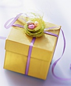 Easter parcel (yellow gift box with Easter decoration)