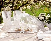 White spring table decoration  (roll & soft cheese under cover)
