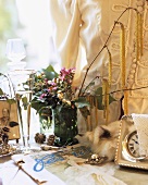 Nostalgic still life with flowers, jewellery & champagne glass