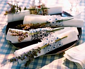 Napkin rings made from strips of fabric with sprigs of lavender