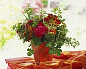 Summer bouquet in shades of red with phlox