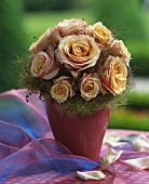 Arrangement of pastel-coloured roses