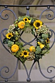 Wreath of ornamental gourds and sunflowers