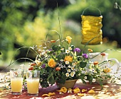 Roses, zinnias, Ageratum, marguerites in an arrangement