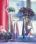 Glass vases of various sizes with hydrangeas