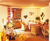 Country house dining room decorated in warm tones and with houseplants