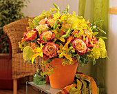 Arrangement of roses, lilies and lady's mantle