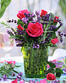 Roses and lavender in glass vase