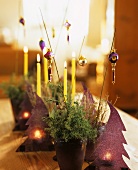 Acrylic trees with candles and arrangement with tree ornaments