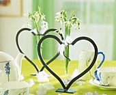 Snowdrops in heart-shaped vases