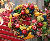 Wreath of pumpkins, apples, Guelder rose berries, hydrangeas