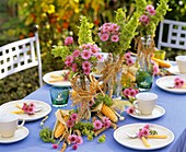 Summer table decoration with flowers