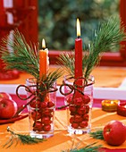 Arrangement with candles, pine sprigs & Christmas baubles