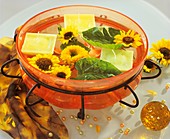 Bowl of sunflowers and floating candles