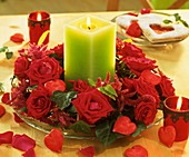 Wreath of red roses, ivy and Amaranthus with green candle