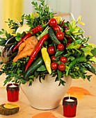 Arrangement of vegetables with sprigs of box 