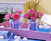 Roses in cups on a tray