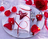 Napkin decoration with heart and rose petals