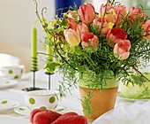 Arrangement of tulips, ivy and ornamental asparagus