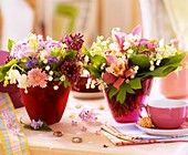 Small posies of spring flowers as table decoration