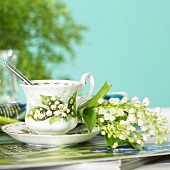 Cup and saucer with lilies of the valley