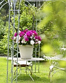 Peonies in flowerpot on garden table