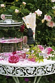 Romantic table with roses, rose punch and love poem