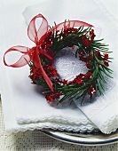 Spruce wreath with stars and artificial berries
