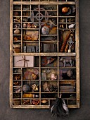 Type case filled with assorted trinkets