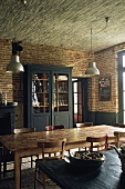 Rustic dining room with brick walls and large wooden table