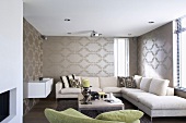 Interior with pattern of ellipses on silver-grey wallpaper, white corner couch, coffee table and sideboard