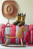 Coyboy hat, boots and rocking horse