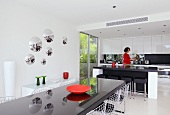 Woman in kitchen of Villa Bamboo, Southern France
