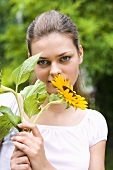Young woman with a sunflower