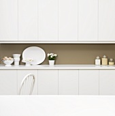White kitchen units with various decorative items