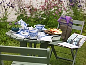 Table laid for afternoon tea in garden