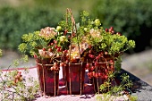 Glasses filled with viburnum berries, dahlias & dill
