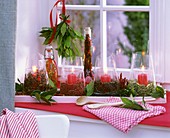 Advent arrangement of windlights and spices