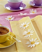 Hot chocolate on table with springtime decorations