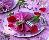 Place-setting with lilac and peony petals