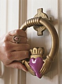 Hand on a door knocker