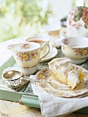 A tea service on a tray with meringue cake